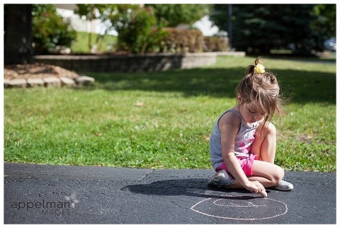 Naperville Child Lifestyle Photography, color photograph of child drawing with chalk
