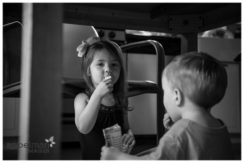 naperville child photographer, color photograph of young children sharing a snack, black and white, apple snacks, lifestyle photography, photojournalism, photojournalistic