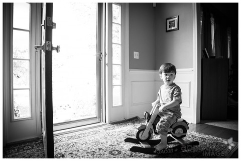 Naperville In home Child portraits, picture of little boy on rocking horse in black and white