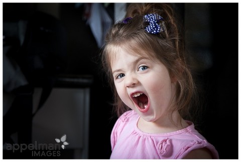 Naperville Child Photographer | Cheeky Girl | Color photo of child wearing pink shirt, Naperville Family Photographer, Best Photographer in Naperville, Family Portraits with heart, Honest Photography