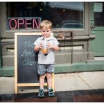 lifestyle image of small boy with apple cider