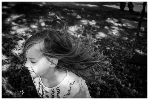 Movement in photography with little girl lifestyle photojournalistic portrait in black and white