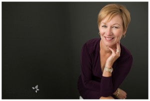 Professional Portrait by Appelman Images Naperville Studio maroon dress red haired professional woman's portrait on grey background