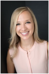 Young professional portrait by naperville photographer woman in pale pink top and blonde hair with grey background