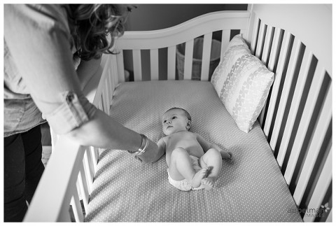 Naperville and Chicago Photographer for families and children mama and little girl holding hands at crib
