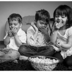 Laughter and Popcorn for three siblings by Naperville family photographer