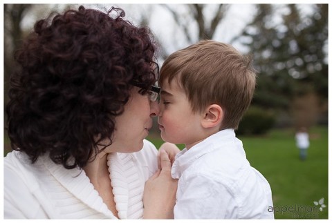 Sweet boy snuggles with his mama nose to nose in treasured family photo by Naperville photographer