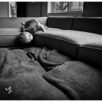 baby on the couch black and white photo of little one at home playing by naperville candid photographer lifestyle session