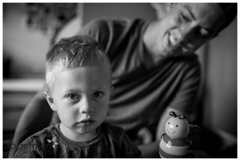 dad and serious boy black and white photo candid lifestyle photographer in Naperville