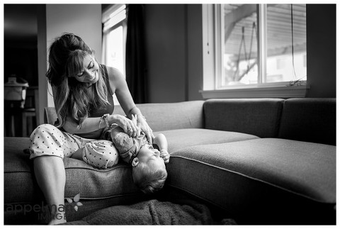 mama and baby playing on the couch by lifestyle photographer for family and kids in naperville