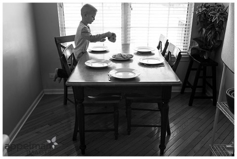 Oswego Family Lifestyle Photographer boy at the table