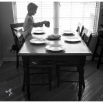 Oswego Family Lifestyle Photographer boy at the table