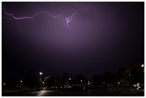 storm photo of lightning across the purple sky naperville