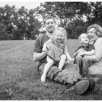 Happy family in black and white on lawn in naperville lifestyle