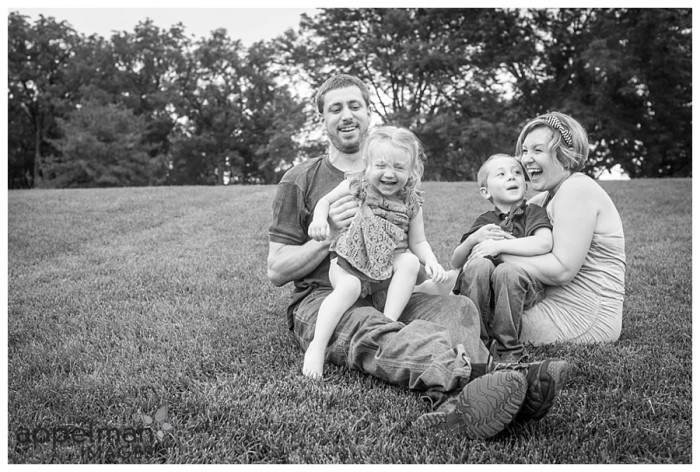 Happy family in black and white on lawn in naperville lifestyle