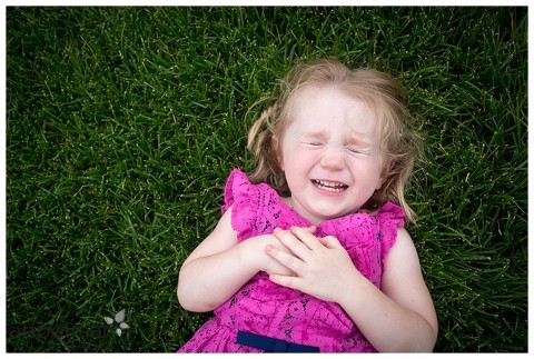 little girl in pink on grass naperville lifestyle photographer