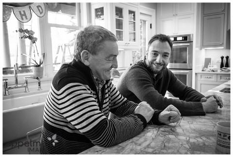 Father in law and son in law in kitchen photojournalistic family pictures