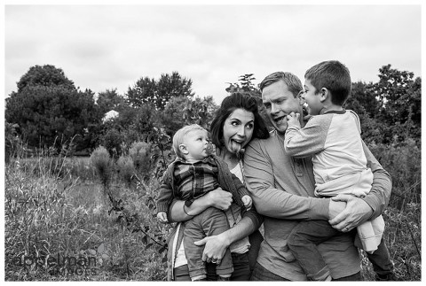 Fun family portrait in black and white by lifestyle photographer
