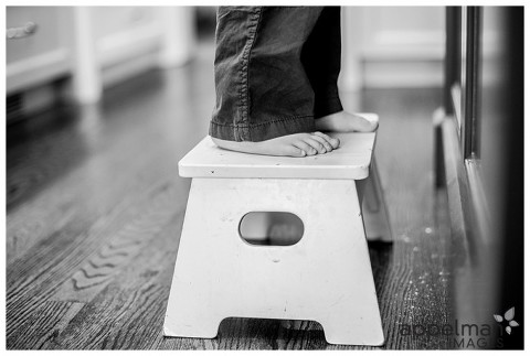 Toes in bw on stool in kitchen lifestyle photo
